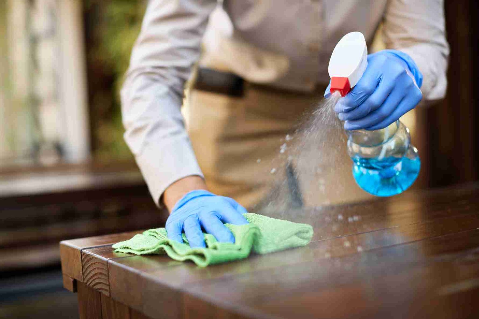 closeup waitress disinfecting tables outdoor cafe 1