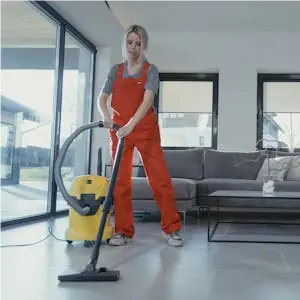 Woman-vacuuming-office-floor